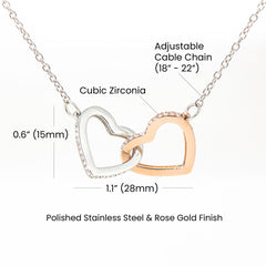 A delicate necklace with two interlocking hearts, symbolizing love and connection.