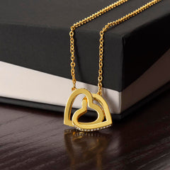 A delicate necklace with two interlocking hearts, symbolizing love and connection.