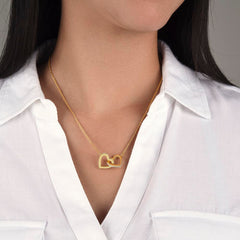 A delicate necklace with two interlocking hearts, symbolizing love and connection.
