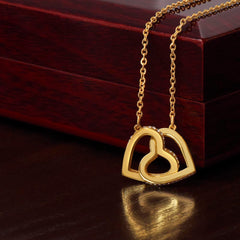 A delicate necklace with two interlocking hearts, symbolizing love and connection.